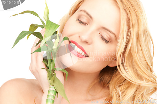 Image of woman with sprout over white
