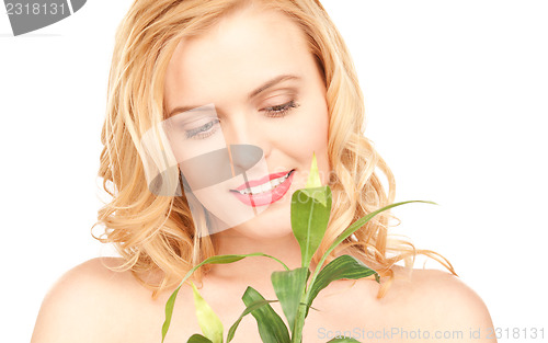 Image of woman with sprout over white