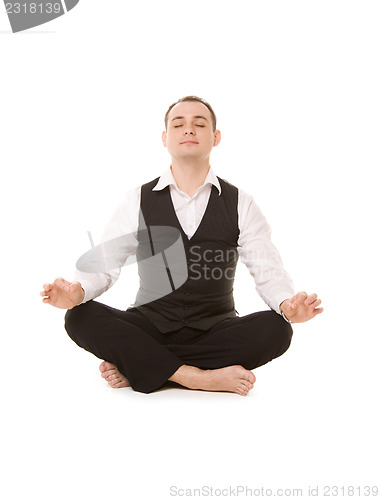 Image of businessman sitting in lotus pose