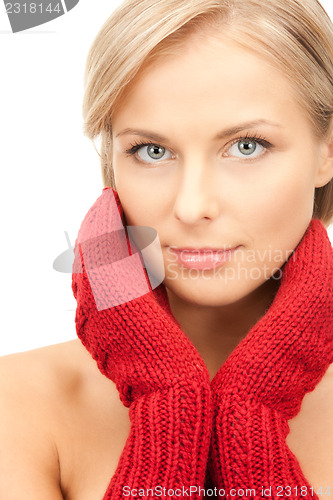 Image of beautiful woman in red mittens 