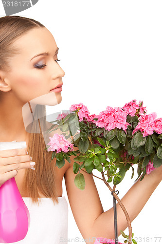 Image of lovely housewife with flowers