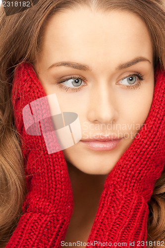 Image of beautiful woman in red mittens 