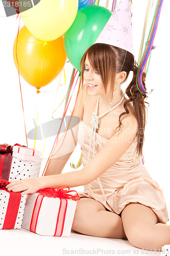 Image of party girl with balloons and gift box