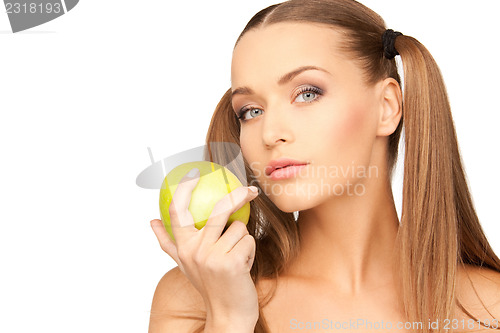 Image of young beautiful woman with green apple