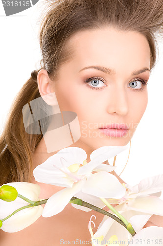 Image of beautiful woman with white flower