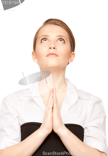 Image of praying teenage girl