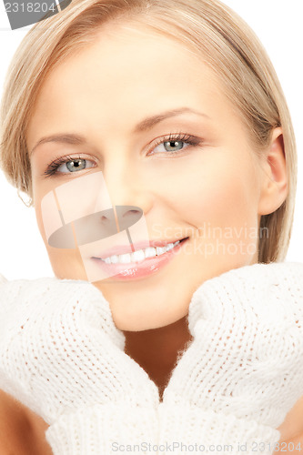 Image of beautiful woman in white mittens 