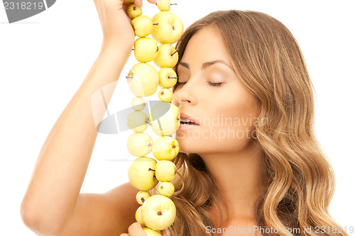 Image of lovely woman with green apples