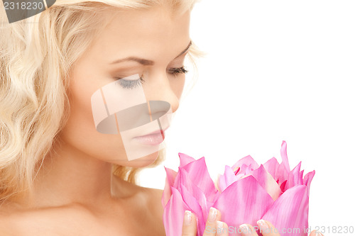 Image of beautiful woman with lotus flower