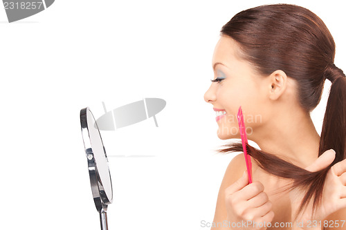 Image of beautiful woman with comb 