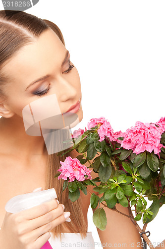 Image of lovely housewife with flowers