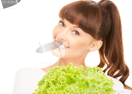 Image of beautiful housewife with lettuce over white