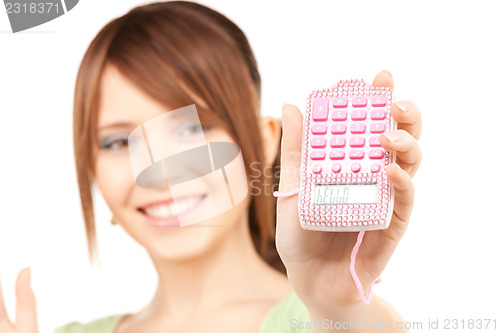 Image of lovely teenage girl with calculator