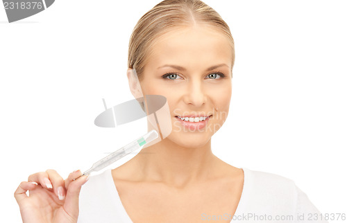 Image of attractive female doctor with thermometer