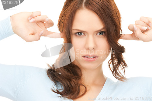 Image of woman with fingers in ears