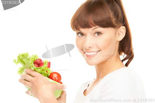 Image of beautiful housewife with vegetables