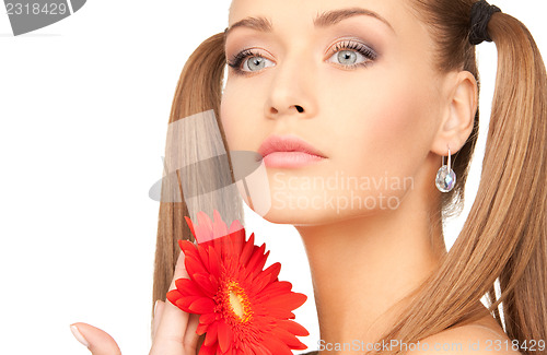 Image of woman in towel with red flower