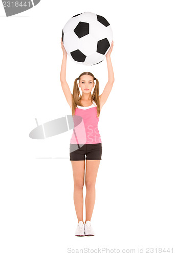 Image of lovely woman with big soccer ball