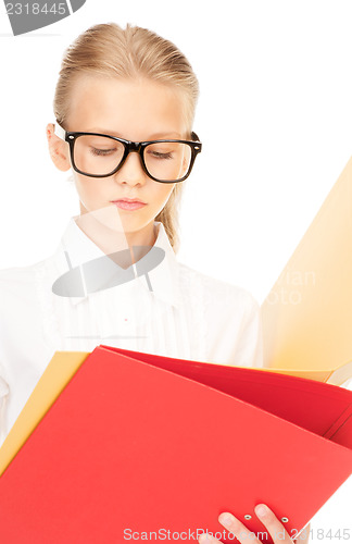 Image of elementary school student with folders 