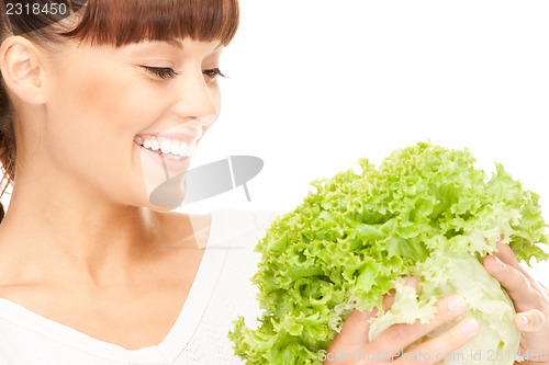 Image of beautiful housewife with lettuce over white