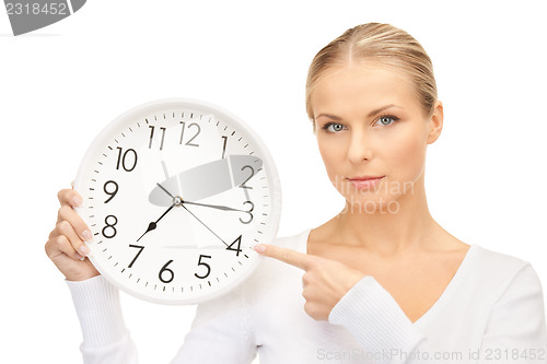 Image of woman holding big clock