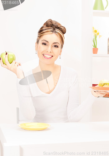 Image of woman with green apple and sandwich