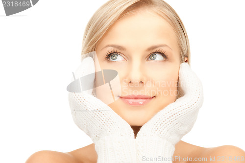 Image of beautiful woman in white mittens