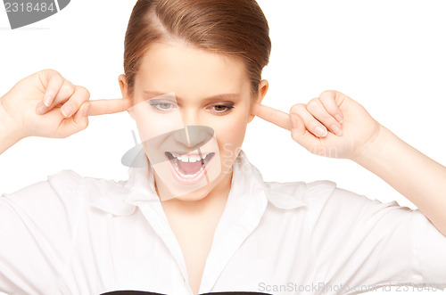 Image of woman with fingers in ears