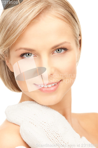 Image of beautiful woman in white mittens 