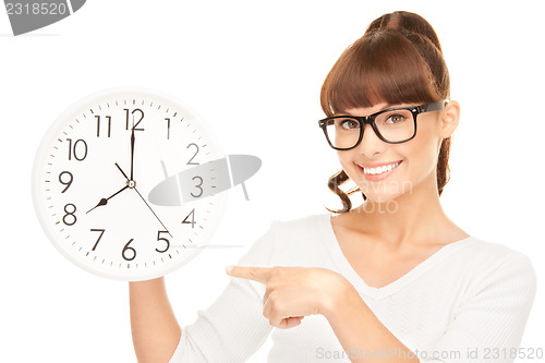 Image of woman holding big clock