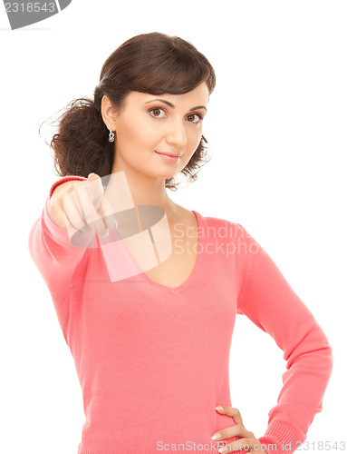 Image of attractive businesswoman pointing her finger