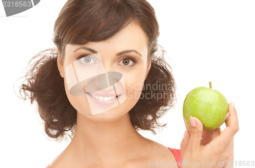 Image of young beautiful woman with green apple