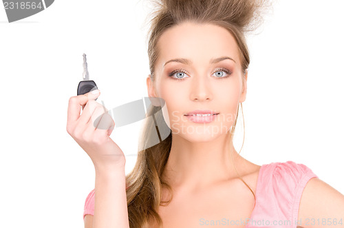 Image of happy woman with car key