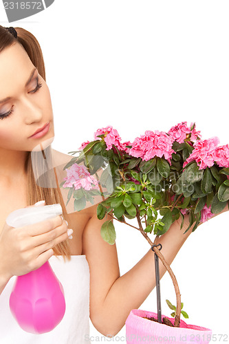 Image of lovely housewife with flowers