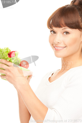 Image of beautiful housewife with vegetables