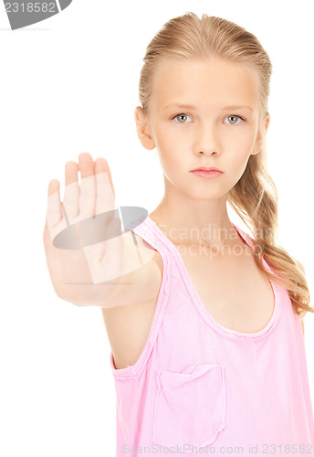 Image of lovely girl showing stop sign