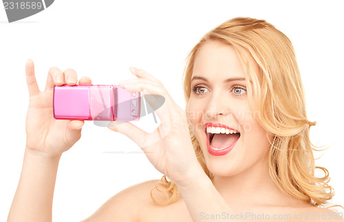 Image of happy woman using phone camera