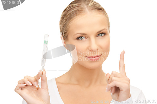 Image of attractive female doctor with thermometer