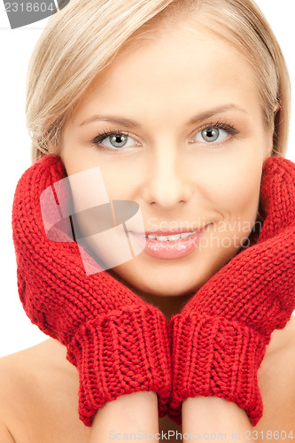 Image of beautiful woman in red mittens 