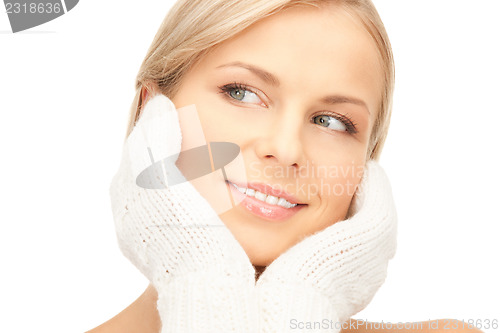 Image of beautiful woman in white mittens 