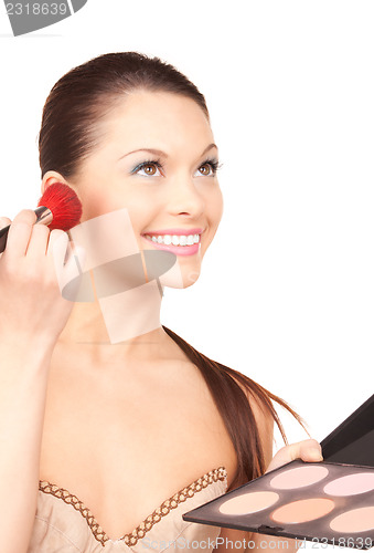 Image of lovely woman with palette and brush