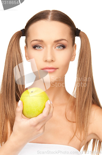 Image of young beautiful woman with green apple