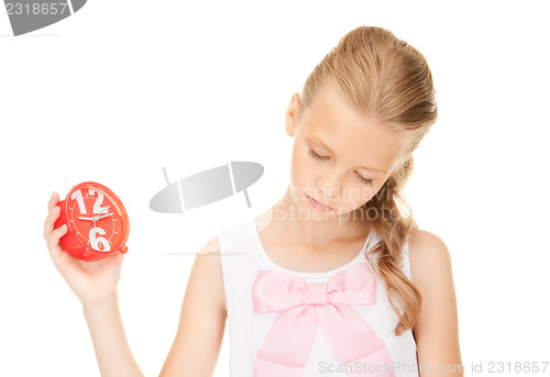 Image of girl holding alarm clock