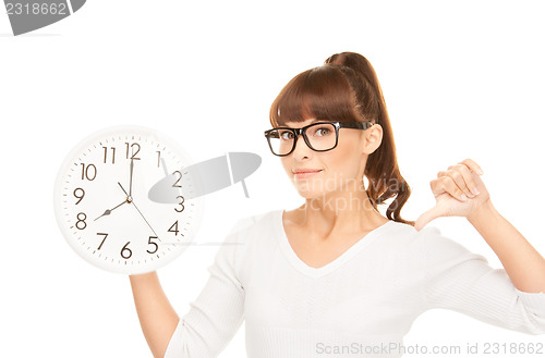 Image of woman holding big clock