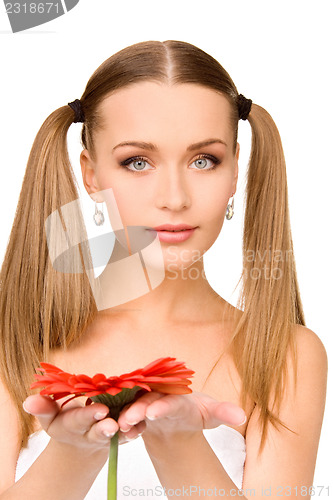 Image of woman in towel with red flower