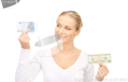 Image of woman with euro and dollar money notes