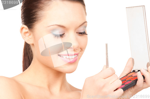 Image of lovely woman with palette and brush