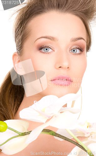 Image of beautiful woman with white flower