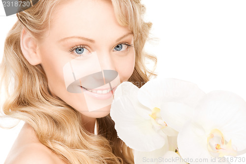 Image of beautiful woman with white flower