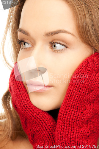 Image of beautiful woman in red mittens 